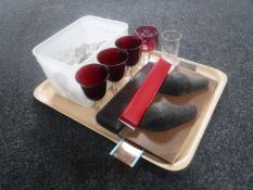 A tray containing assorted drinking glasses, antique decanter, brass instrument in case,