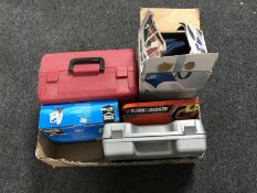 A box of Black & Decker vacuum, Powerdevil hand saw, McAllister jigsaw, Black & Decker mouse,