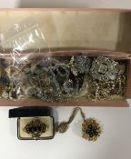 A collection of jewellery; Victorian yellow metal locket on chain, Victorian simulated ruby brooch,