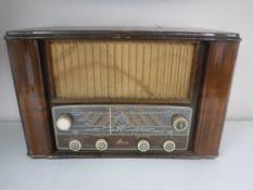 A mid 20th century walnut cased Mohawk 562 valve radio (continental wiring)
