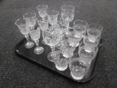 A tray containing assorted antique drinking glasses