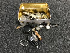 A tin containing various lady's and gent's wristwatches together with a mid 20th century desk clock