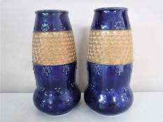 A pair of Royal Doulton glazed pottery vases,