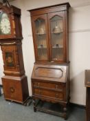 An Edwardian oak and leaded glass bureau bookcase,