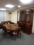 A mahogany G-Plan oval extending dining table together with a set of six chairs