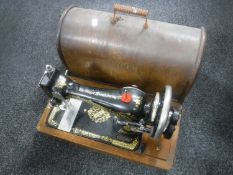 A mid 20th century oak cased Singer hand sewing machine