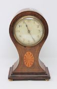 A late Victorian balloon shaped inlaid mahogany mantel clock