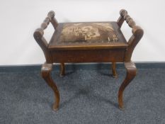 An Edwardian storage piano stool