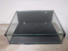 A glazed counter top display cabinet