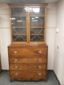 A George III inlaid mahogany secretaire bookcase, with later astragal glazed top,