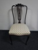 A mahogany glass topped coffee table and an antique bedroom chair
