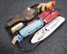 A tray of Schuco wind up monkey, leather gun holster,