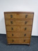 A walnut five drawer chest