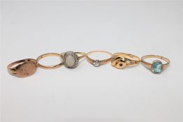 An 18ct gold ring, two 9ct gold rings, a diamond solitaire ring,