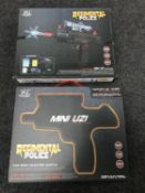 Two boxed Regimental Police mini uzi water guns