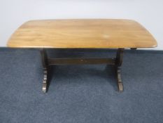An Ercol elm refectory dining table