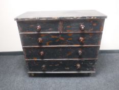 An antique painted pine four drawer chest