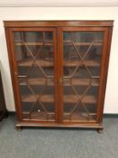 An Edwardian mahogany astragal glazed bookcase,