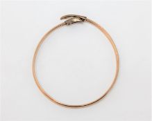 A 9ct gold dolphin bangle CONDITION REPORT: 6.