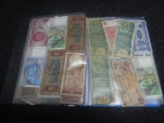 A folder containing banknotes of the world