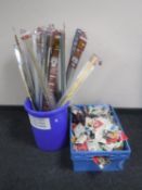 A plastic crate and bucket of floor gripping rods and door numbers