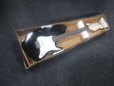 An Elevation electric guitar with strap