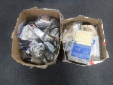 Two large boxes of hoover bags and hoover belts