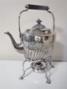 A silver plated spirit kettle on stand with burner