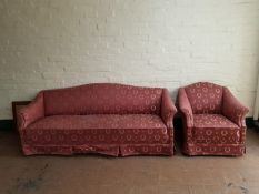An early 20th century continental three seater settee and armchair in classical upholstery