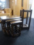 A nest of three oak tables together with an Edwardian oak stick stand