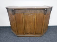 An oak linen fold cocktail bar