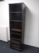 A set of narrow contemporary open shelves fitted two drawers beneath