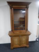 A late 19th century walnut single door bookcase