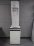 A Clover hot and cold water dispenser and a tricity under bench fridge