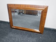 An antique mahogany framed bevelled edge mirror