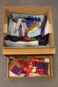 A collection of Masonic items including medals, badges, sashes, cuffs, books,