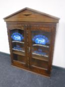 An Edwardian bookcase top bearing Rington's Tea Merchants advertising