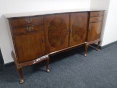 A walnut Queen Anne style inverted breakfront sideboard