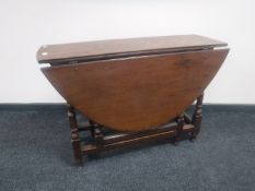 A Victorian oak gate leg table