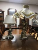 A figural chalk table lamp of a cherub plus another similar with shade