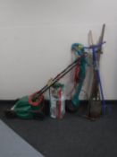 A bundle of garden tools, fence sprayer,