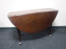 A Victorian mahogany drop leaf table on club feet