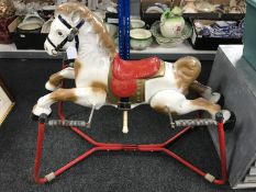 A 1950's tin plate horse on rocker
