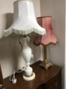 A chalk Corinthian column table lamp with shade and a marble and brass table lamp with shade