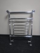 A chrome towel rail and a 3 kilowatt fan heater