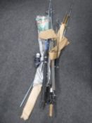 Five assorted fishing rods (two with reels)
