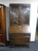 An Edwardian oak bureau bookcase