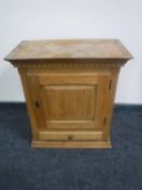 A continental blonde oak wall cabinet fitted a drawer