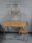 A contemporary kitchen table and two chairs