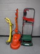 A Flymo electric mower,